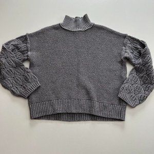Chunky grey knit sweater.